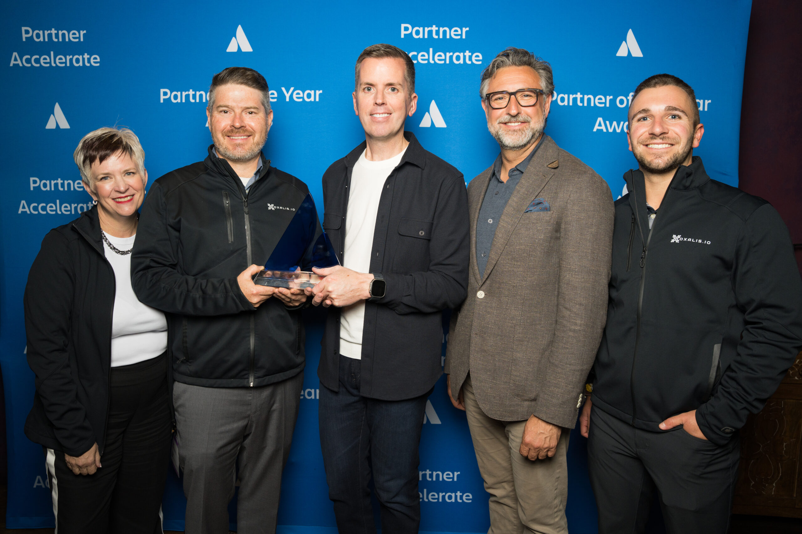 The Oxalis Solutions team, led by CEO, Jon Malanche, accepting the award for Services Delivery, Americas at Atlassian Team '26.