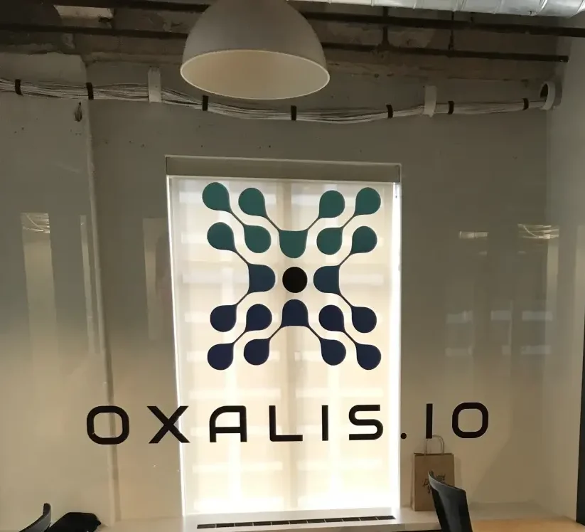 An early Oxalis office, company logo on the glass wall